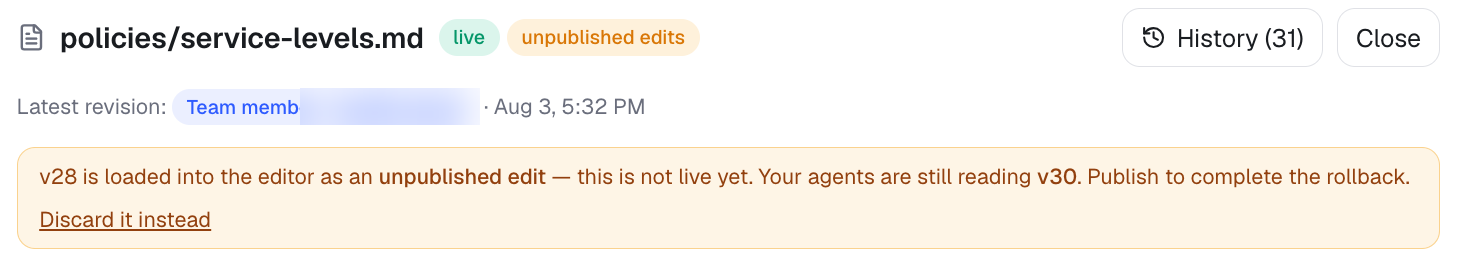 An amber banner reading "v28 is loaded into the editor as an unpublished edit — this is not live yet. Your agents are still reading v30. Publish to complete the rollback." with a "Discard it instead" link.