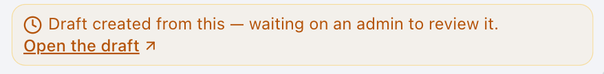 An amber confirmation panel reading "Draft created from this — waiting on an admin to review it", with an "Open the draft" link.